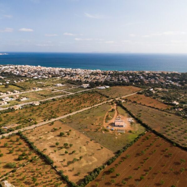 Aerial shot of beautiful blue sea and buildings in Mallorca Balearic Islands in Spain